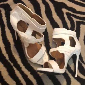 White strap heel with gold buckles